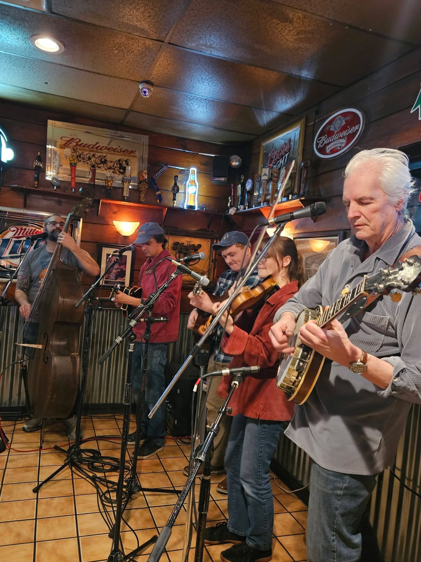 Matt Baldwin playing upright bass with a bluegrass ensemble