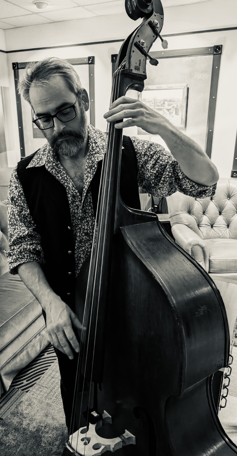 Matt Baldwin playing upright bass in black and white